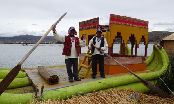 touring Peru men rowing boat