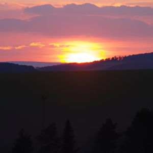 A landscape with a setting sun, in a region with a dramatically different climate than the person is used to.